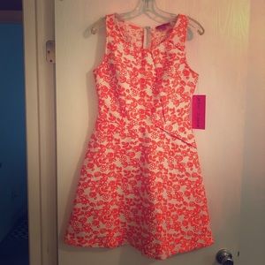 Betsey Johnson Orange embroidered floral on white.